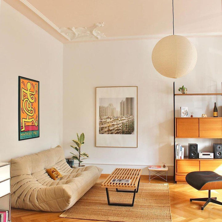 "Elegant modern Japanese paper lantern pendant light with a warm glow, blending contemporary and mid-century design."