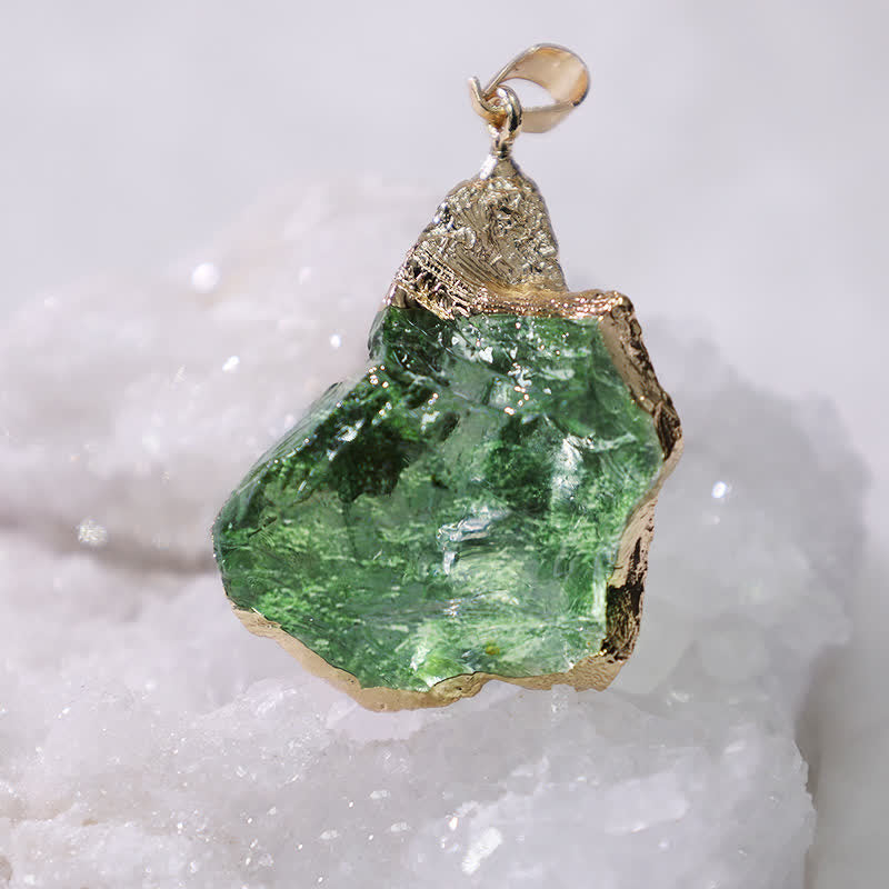 Elegant Moldavite necklace with unique design, featuring a green gemstone. Perfect for adding sophistication to any outfit.