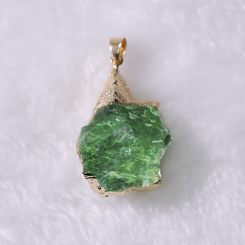 Elegant Moldavite necklace with unique design, featuring a green gemstone. Perfect for adding sophistication to any outfit.