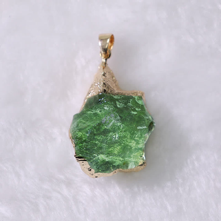 Elegant Moldavite necklace with unique design, featuring a green gemstone. Perfect for adding sophistication to any outfit.