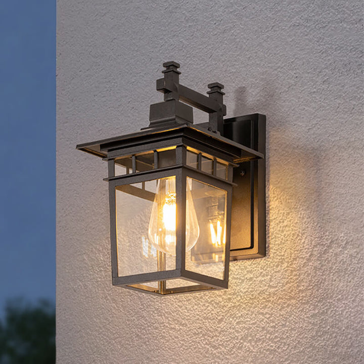 "Elegant outdoor waterproof lantern wall light with black finish and glass shade, perfect for gardens and porches."