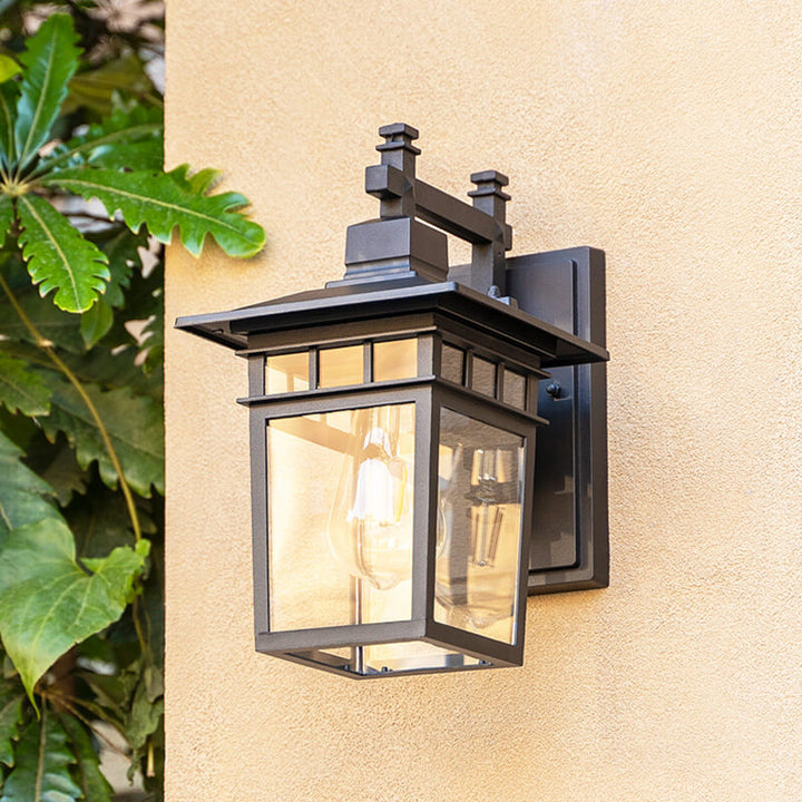 "Elegant outdoor waterproof lantern wall light with black finish and glass shade, perfect for gardens and porches."
