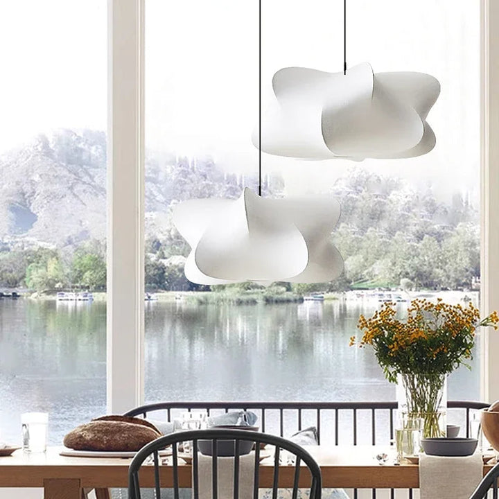 "Elegant pendant lamp with smooth silk finish, minimalist design, offering warm LED light options for modern interiors."