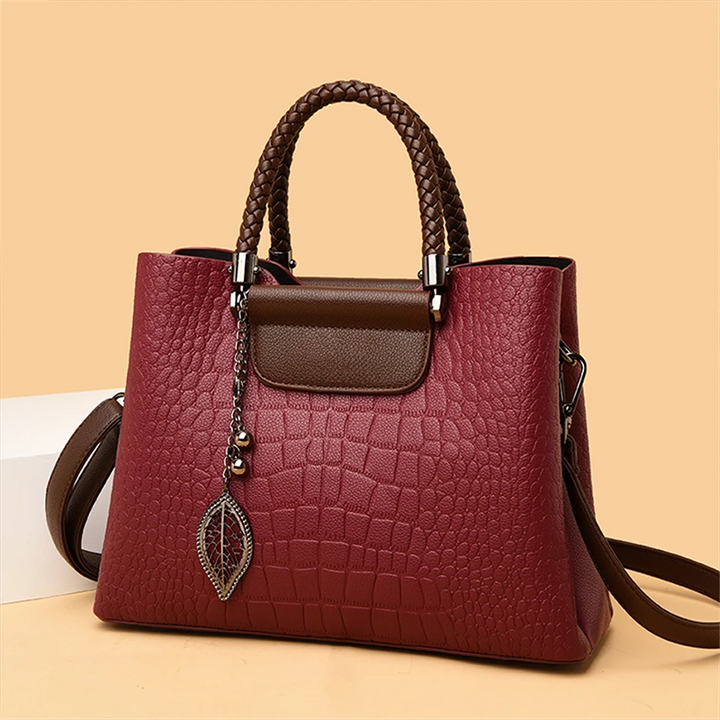 Elegant teak women's handbag with luxe design, showcasing premium craftsmanship and spacious interior in classic colors.