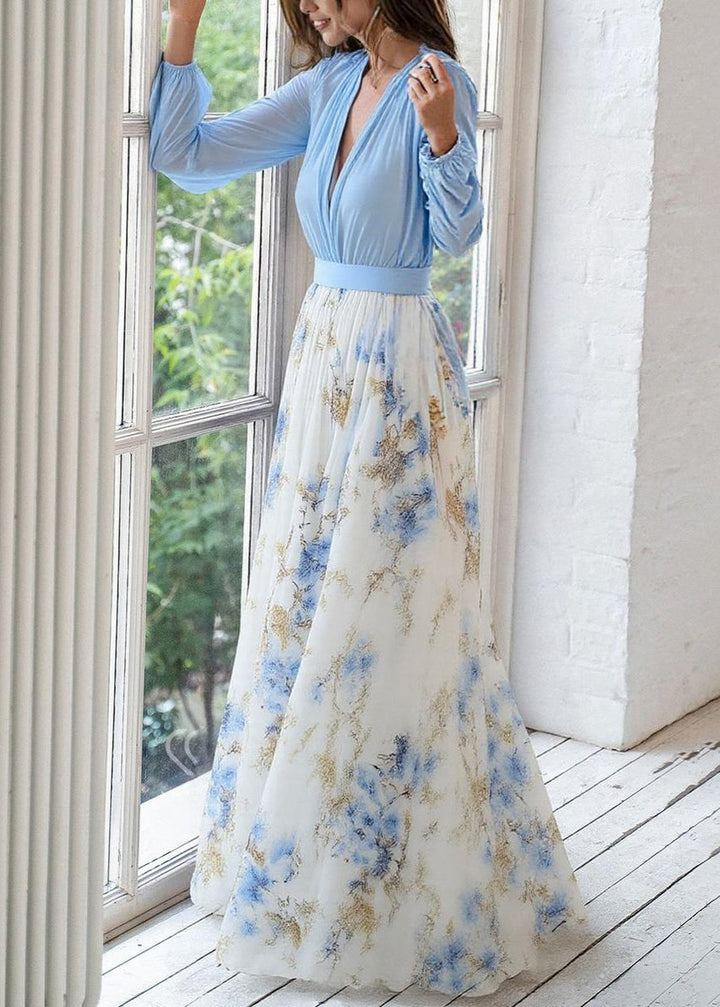 Elegant V-Neck floral maxi dress with long sleeves, features flowing skirt, perfect for occasions, shown on a mannequin.