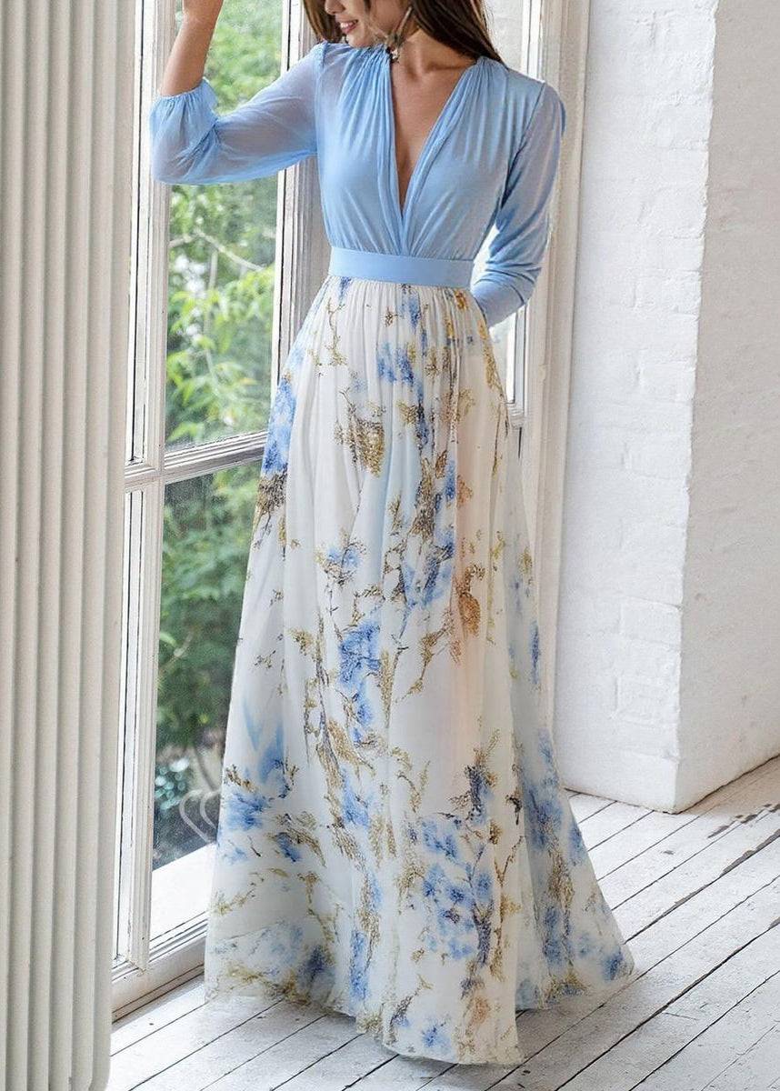 Elegant V-Neck floral maxi dress with long sleeves, features flowing skirt, perfect for occasions, shown on a mannequin.