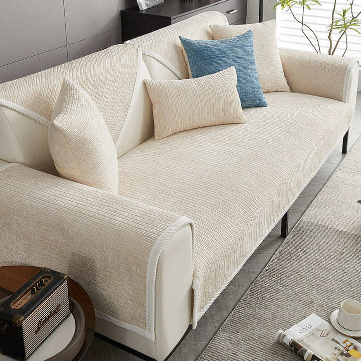 Elegant waterproof chenille sofa cover in soft hues, offering antimicrobial protection and sleek design for home decor.