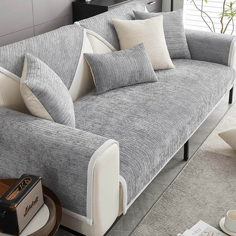 Elegant waterproof chenille sofa cover in soft hues, offering antimicrobial protection and sleek design for home decor.