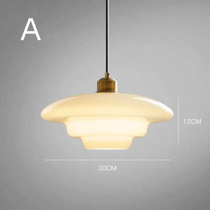 Elegant white glass pendant light with brass fixture, mid-century design, perfect for modern or classic interiors, adds luxur
