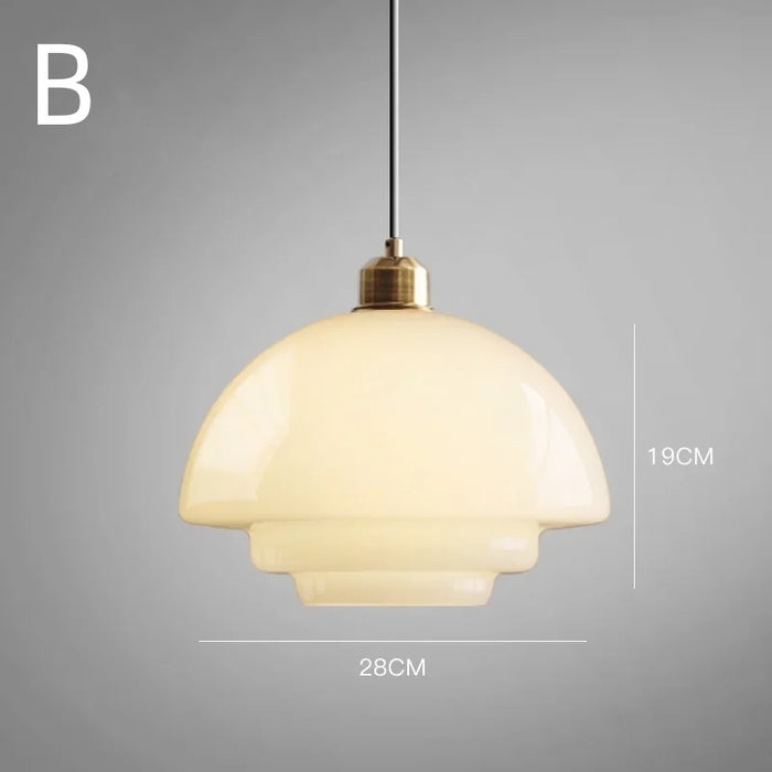Elegant white glass pendant light with brass fixture, mid-century design, perfect for modern or classic interiors, adds luxur