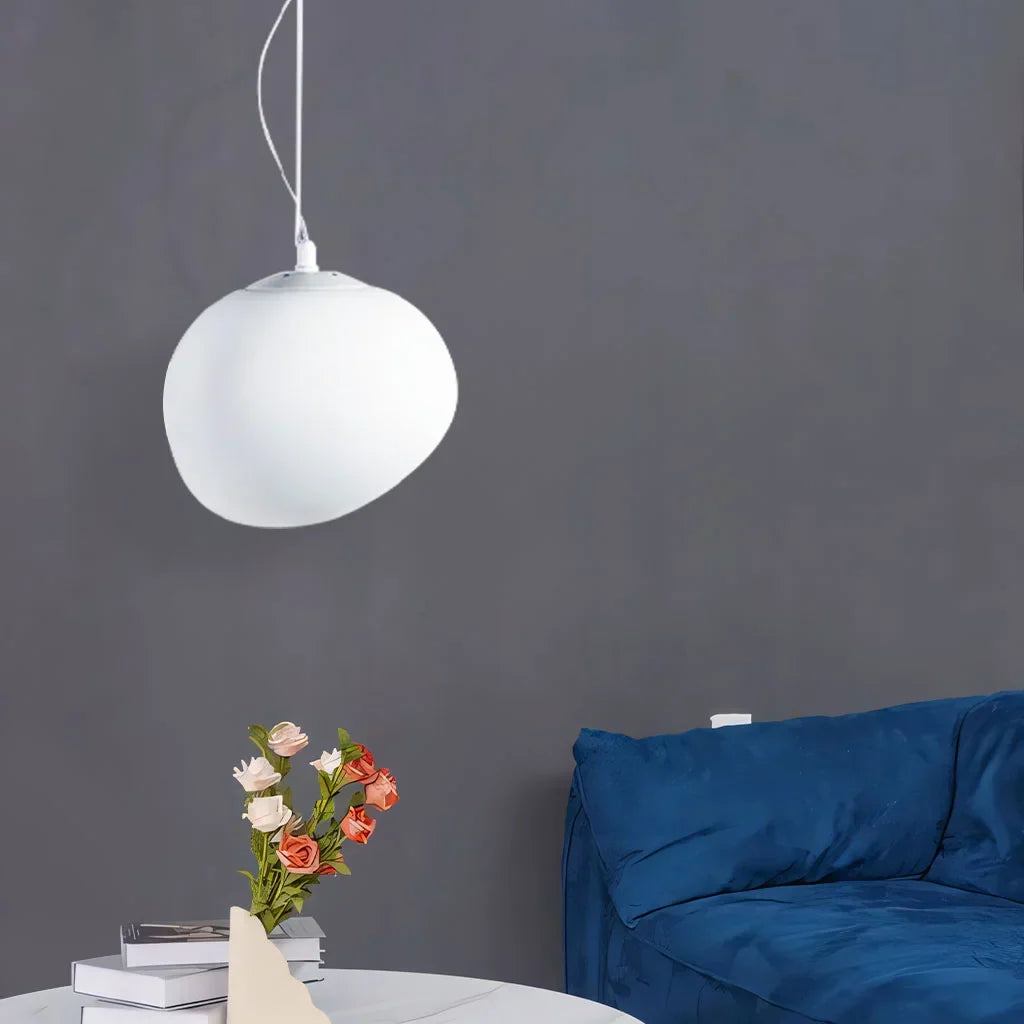 Elegant white pebble pendant light; minimal design, frosted glass, metal accents, soft glow for modern interiors.