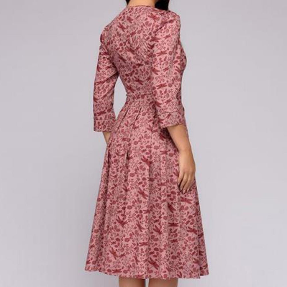 Elegant women's A-line knee-length dress with vibrant floral print, fitted waist, 3/4 sleeves, perfect for spring occasions.