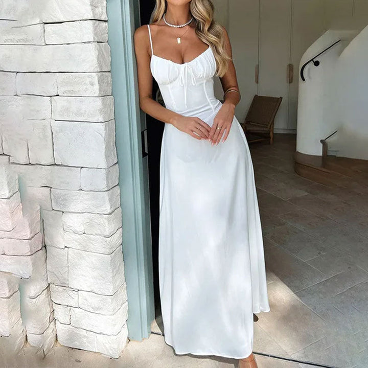 "Elegant women's A-line maxi dress with ruched bodice, satin fabric, delicate straps, ideal for special occasions."