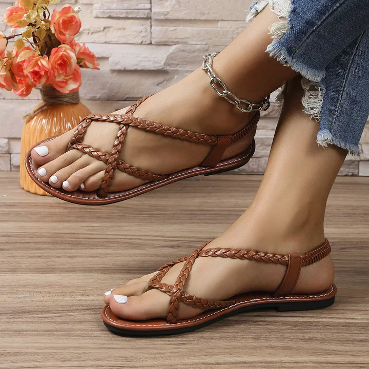 Elegant women's brown flat sandals, stylish and comfortable, perfect for summer occasions or casual outings.