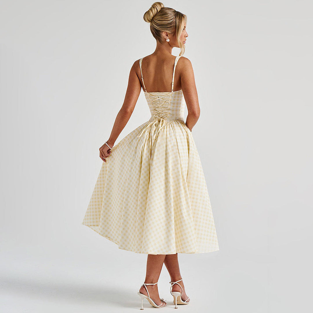 Elegant women's checkered midi dress with square neck and princess silhouette, highlighting classic charm and flattering fit.