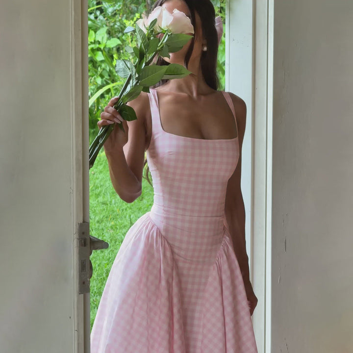 Elegant women's checkered midi dress with square neck and princess silhouette, highlighting classic charm and flattering fit.