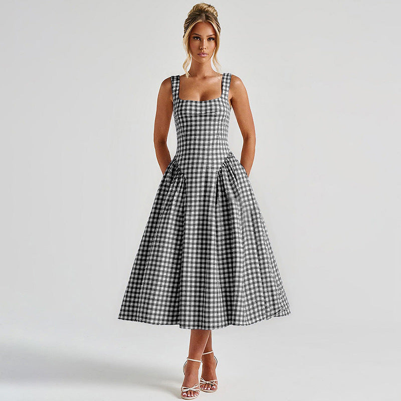 Elegant women's checkered midi dress with square neck and princess silhouette, highlighting classic charm and flattering fit.