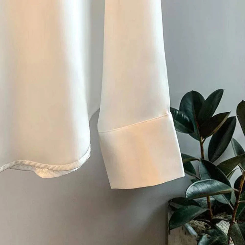 Elegant women's fall blouse in luxurious silk, soft and classic design, perfect for versatile styles and chic silhouettes.