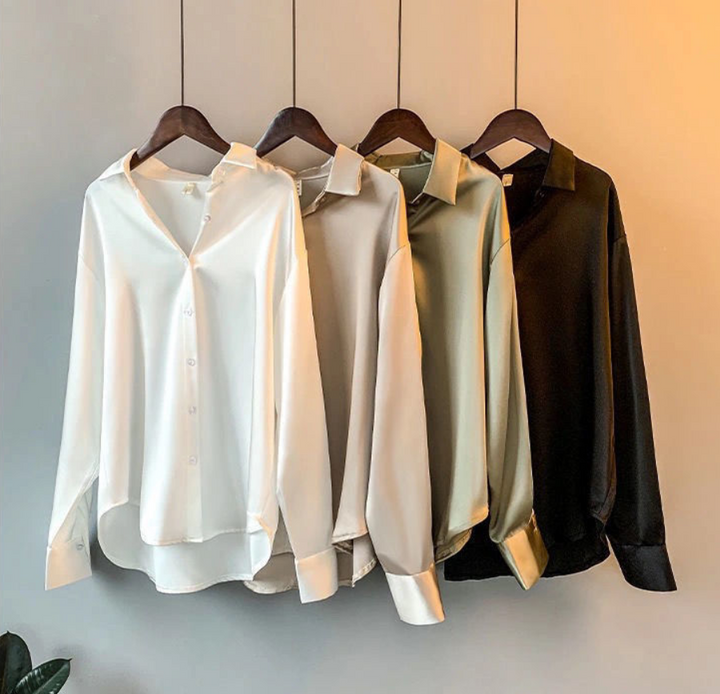 Elegant women's fall blouse in luxurious silk, soft and classic design, perfect for versatile styles and chic silhouettes.
