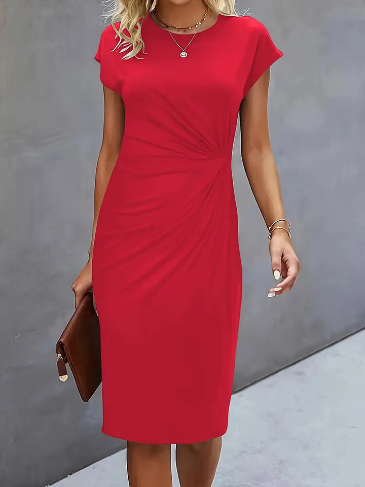 Elegant women's knee-length sheath dress with ruched waist, shown in dark green. Perfect for day-to-night wear.