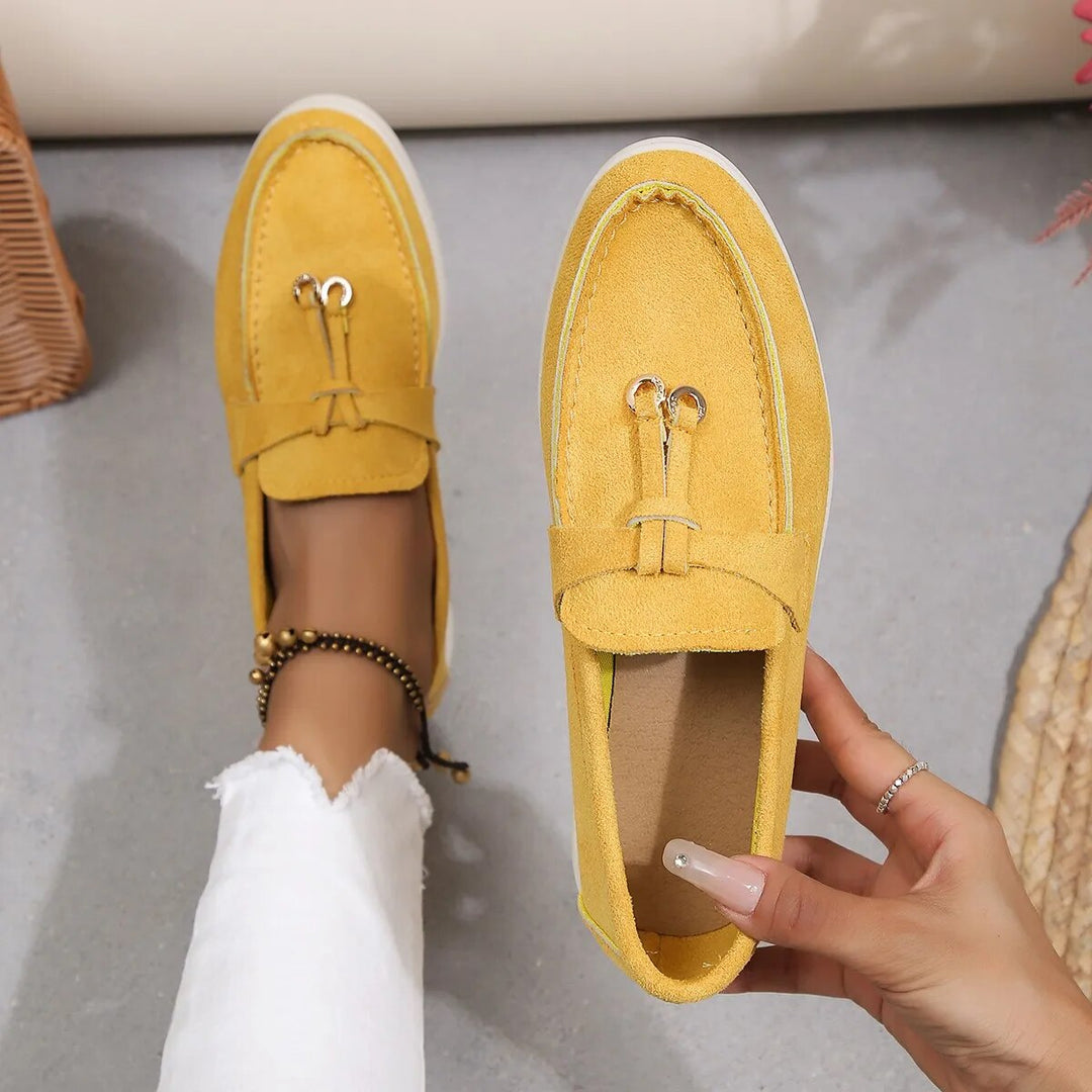 Elegant women's leather loafers in smooth finish, available in various classic and vibrant colors, perfect for all occasions.