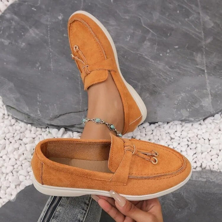 Elegant women's leather loafers in smooth finish, available in various classic and vibrant colors, perfect for all occasions.
