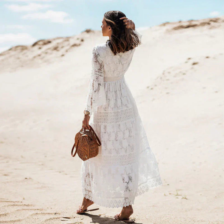 Elegant women's long-sleeved boho dress with artistic details and flowing silhouette, perfect for versatile styling.