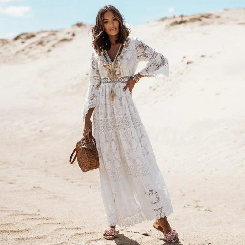 Elegant women's long-sleeved boho dress with artistic details and flowing silhouette, perfect for versatile styling.