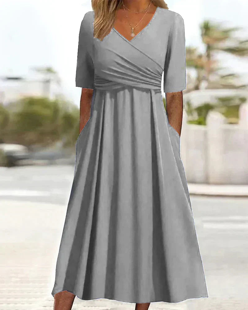 Elegant women's maxi dress with chic V-neck, A-line silhouette, and side pockets, perfect for casual and formal events.