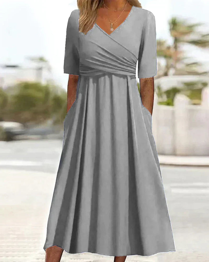 Elegant women's maxi dress with chic V-neck, A-line silhouette, and side pockets, perfect for casual and formal events.