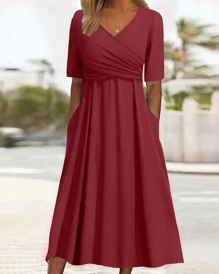 Elegant women's maxi dress with chic V-neck, A-line silhouette, and side pockets, perfect for casual and formal events.