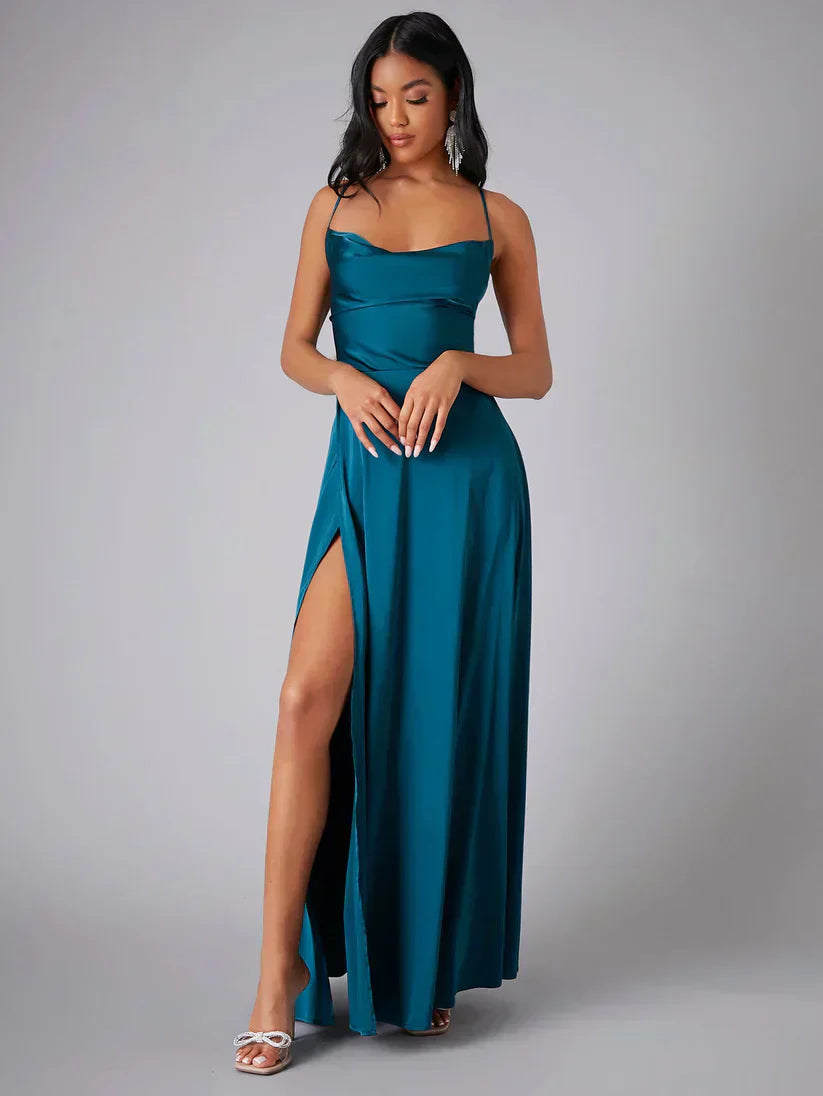 Elegant women's maxi dress with high slit and open back, featuring a figure-flattering silhouette and criss-cross design.