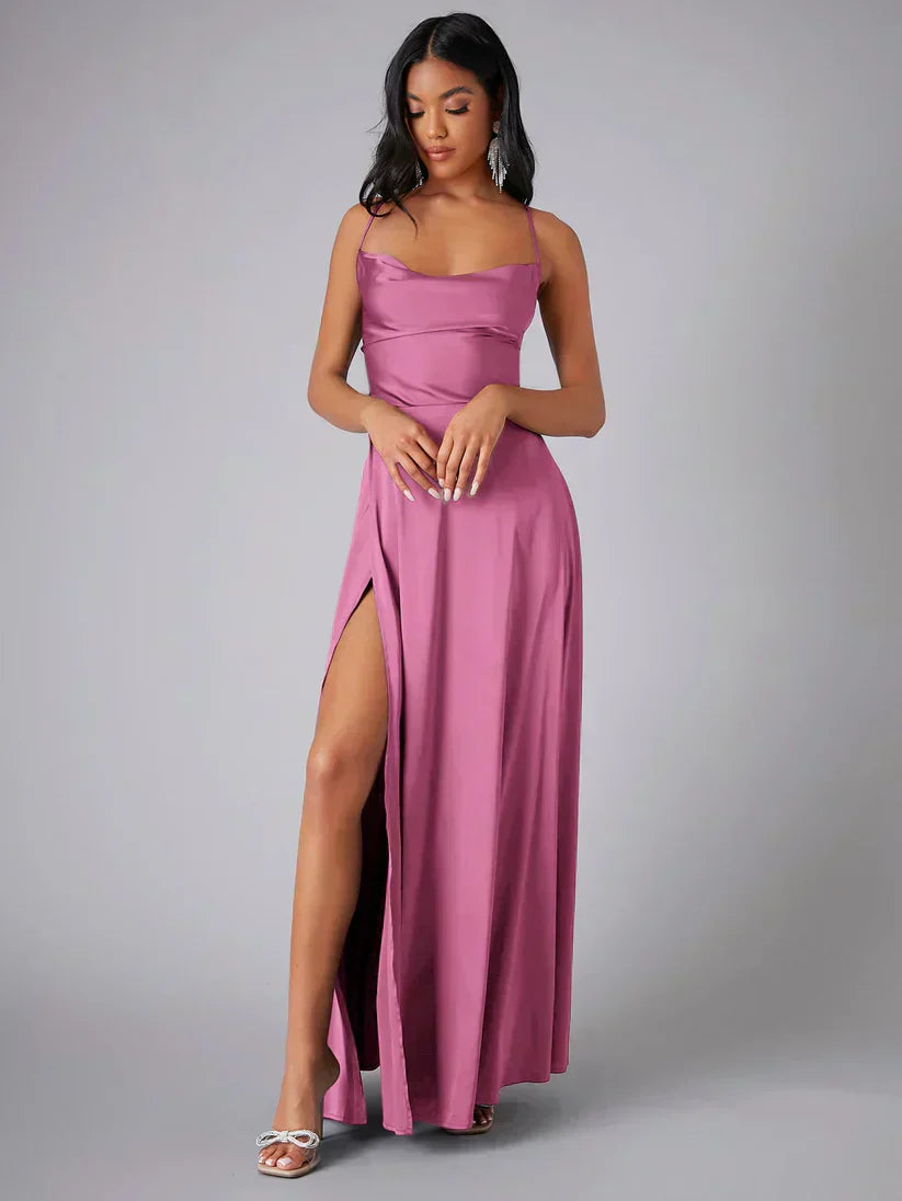 Elegant women's maxi dress with high slit and open back, featuring a figure-flattering silhouette and criss-cross design.