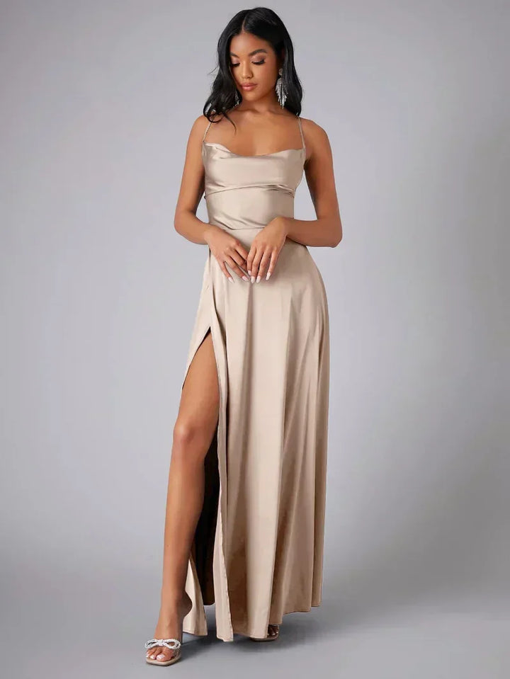 Elegant women's maxi dress with high slit and open back, featuring a figure-flattering silhouette and criss-cross design.