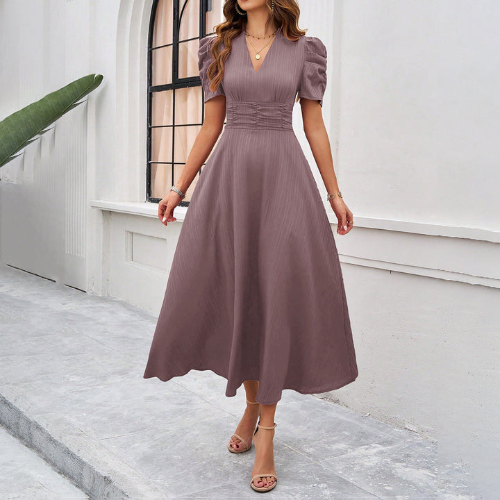 Elegant women's midi dress with a V-neck, puff sleeves, and a ruched waist, fit and flare design, perfect for any occasion.