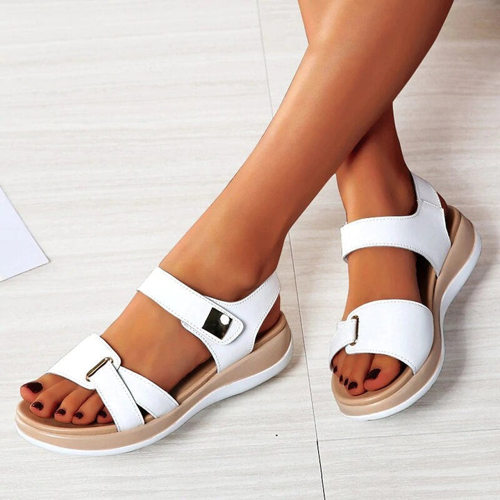 Elegant women's orthopedic sandals with sleek design and foot support, ideal for spring and summer wear.
