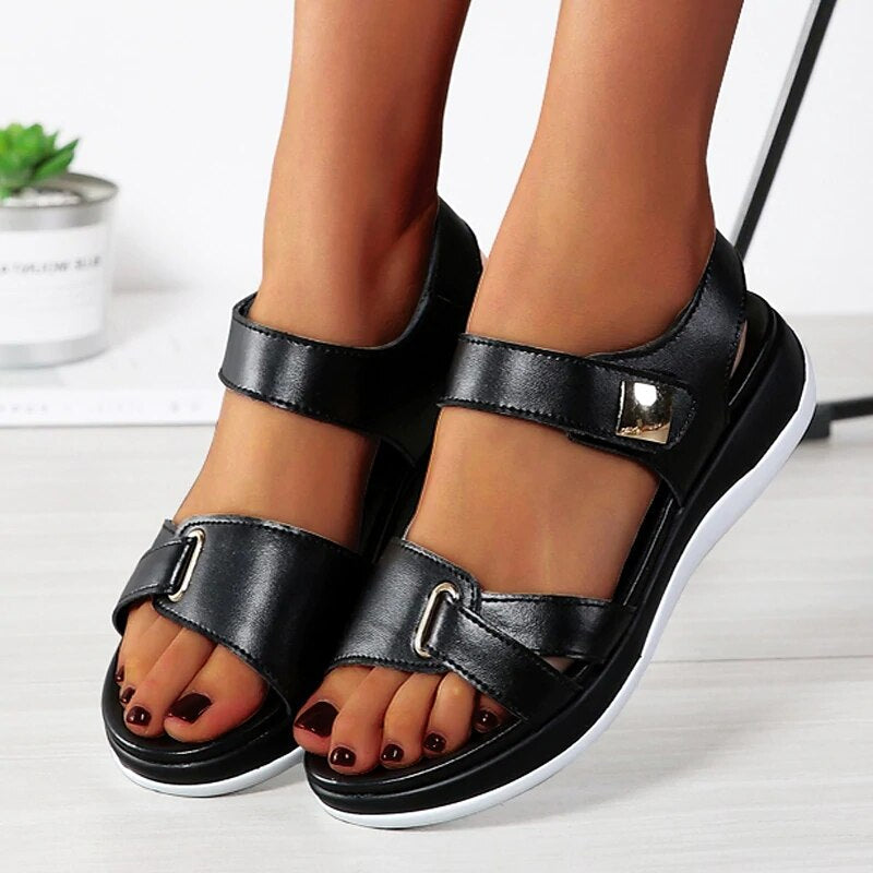 Elegant women's orthopedic sandals with sleek design and foot support, ideal for spring and summer wear.