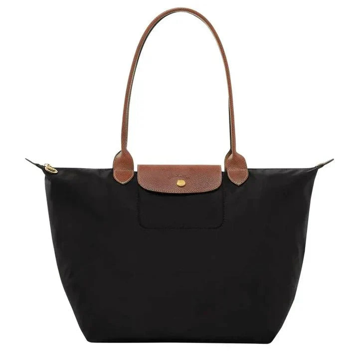 Elegant women's shoulder bag with adjustable straps, spacious interior, chic design for style and functionality.