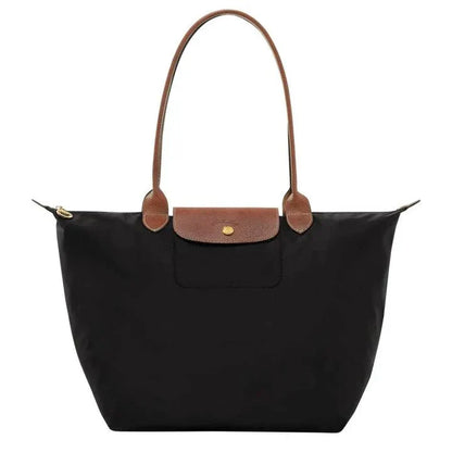 Elegant women's shoulder bag with adjustable straps, spacious interior, chic design for style and functionality.