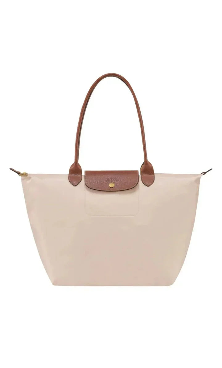 Elegant women's shoulder bag with adjustable straps, spacious interior, chic design for style and functionality.