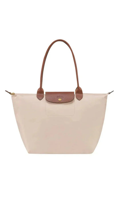 Elegant women's shoulder bag with adjustable straps, spacious interior, chic design for style and functionality.