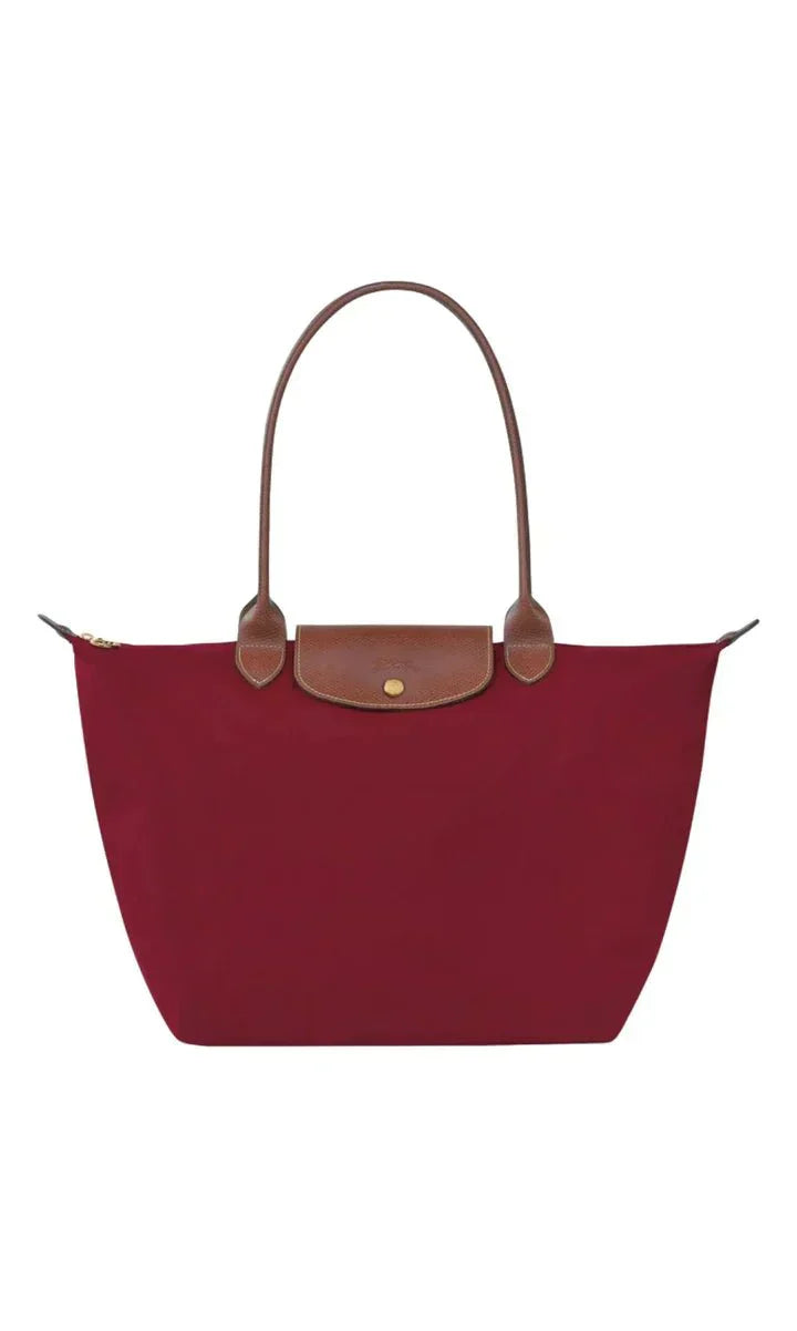 Elegant women's shoulder bag with adjustable straps, spacious interior, chic design for style and functionality.