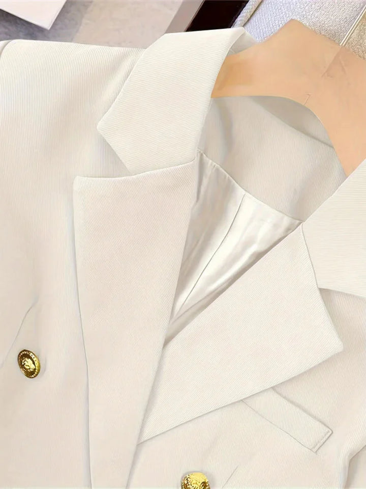 Elegant women's slim blazer with golden buttons, hip-length, long sleeves, in apricot, black, or camel, enhances style.