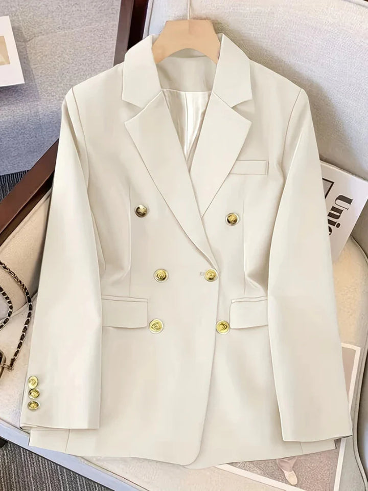 Elegant women's slim blazer with golden buttons, hip-length, long sleeves, in apricot, black, or camel, enhances style.
