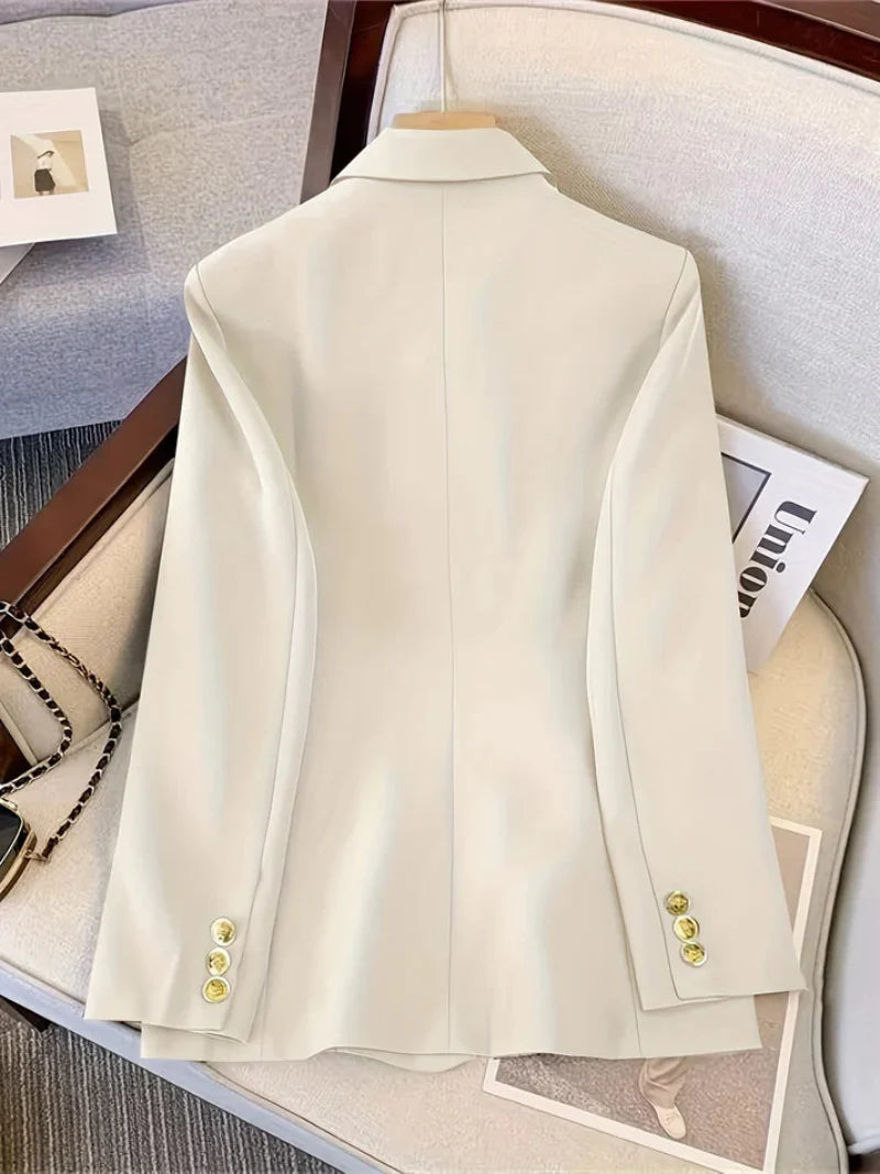 Elegant women's slim blazer with golden buttons, hip-length, long sleeves, in apricot, black, or camel, enhances style.