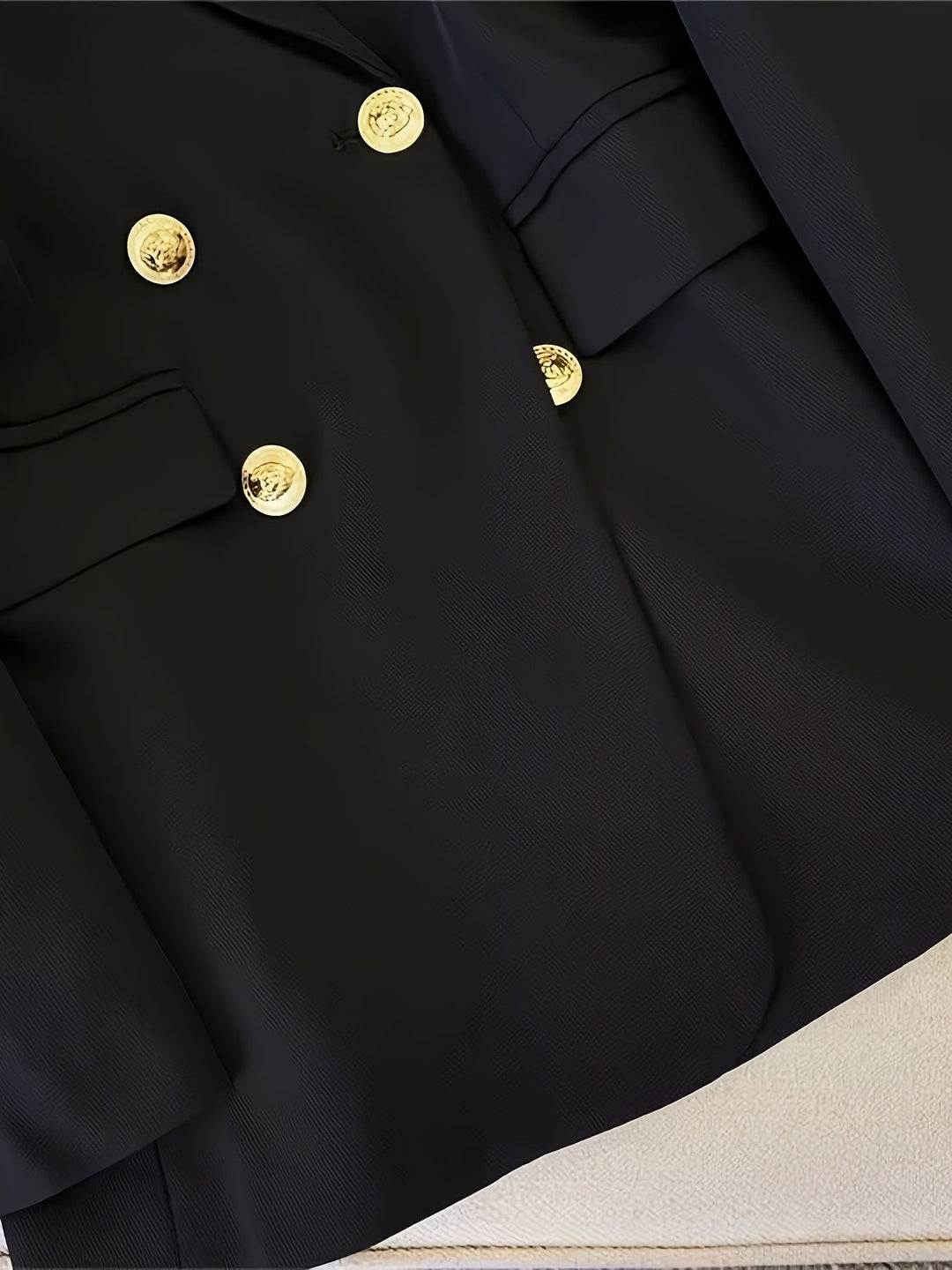 Elegant women's slim blazer with golden buttons, hip-length, long sleeves, in apricot, black, or camel, enhances style.