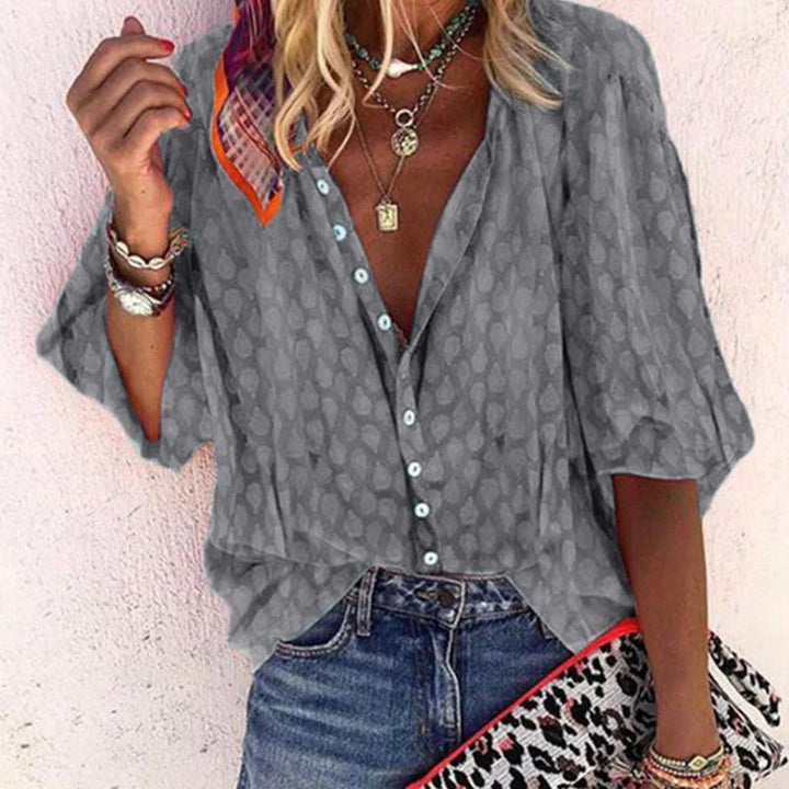 Elegant women's summer blouse with airy fit, versatile design; ideal for chic warm-weather outings and casual gatherings.