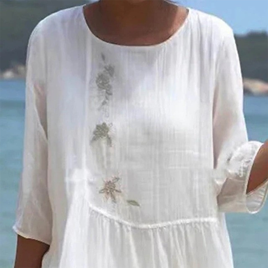 "Elegant women's white maxi dress, flowing silhouette, ideal for summer beach outings and casual elegance."