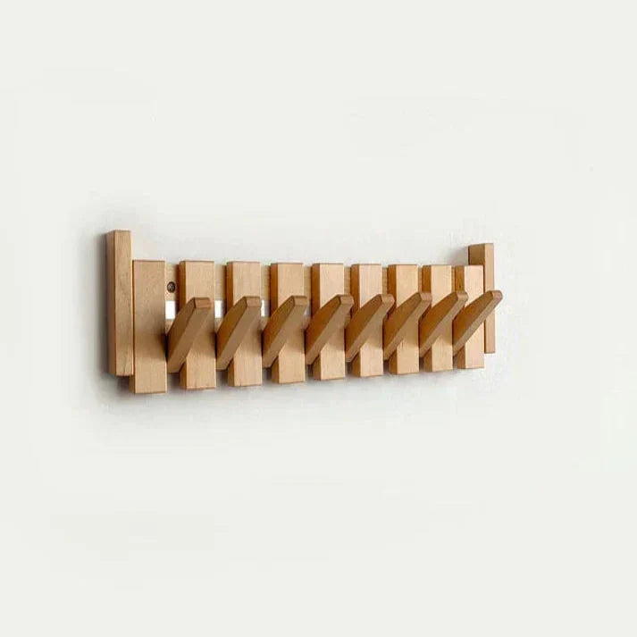 "Elegant wooden coat rack with piano key design, featuring multiple hooks for organizing coats and accessories."