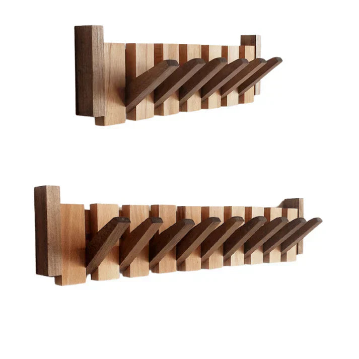 "Elegant wooden coat rack with piano key design, featuring multiple hooks for organizing coats and accessories."